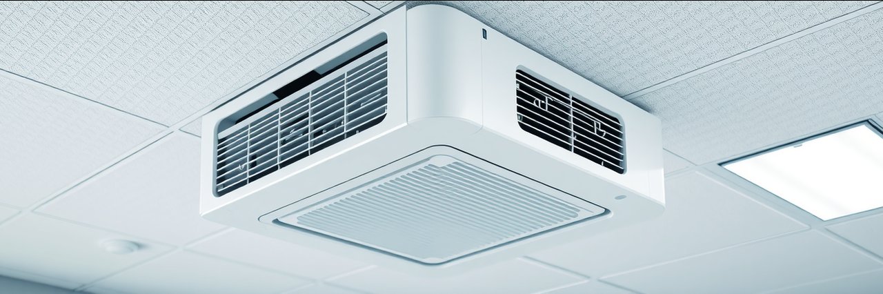 Modern ceiling air conditioning unit in an office for air conditioning maintenance.