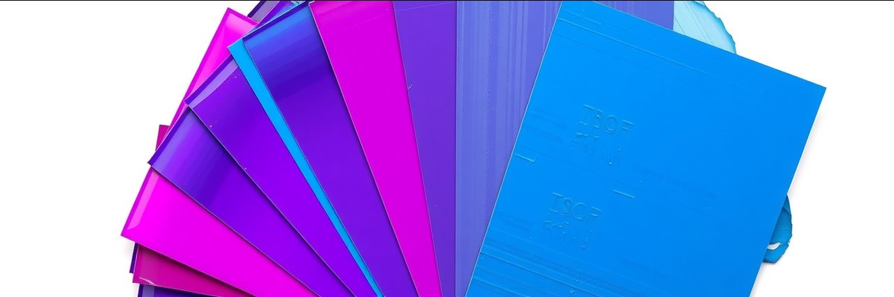 Decorating paint products color swatches in blue and purple gradients, fanned out